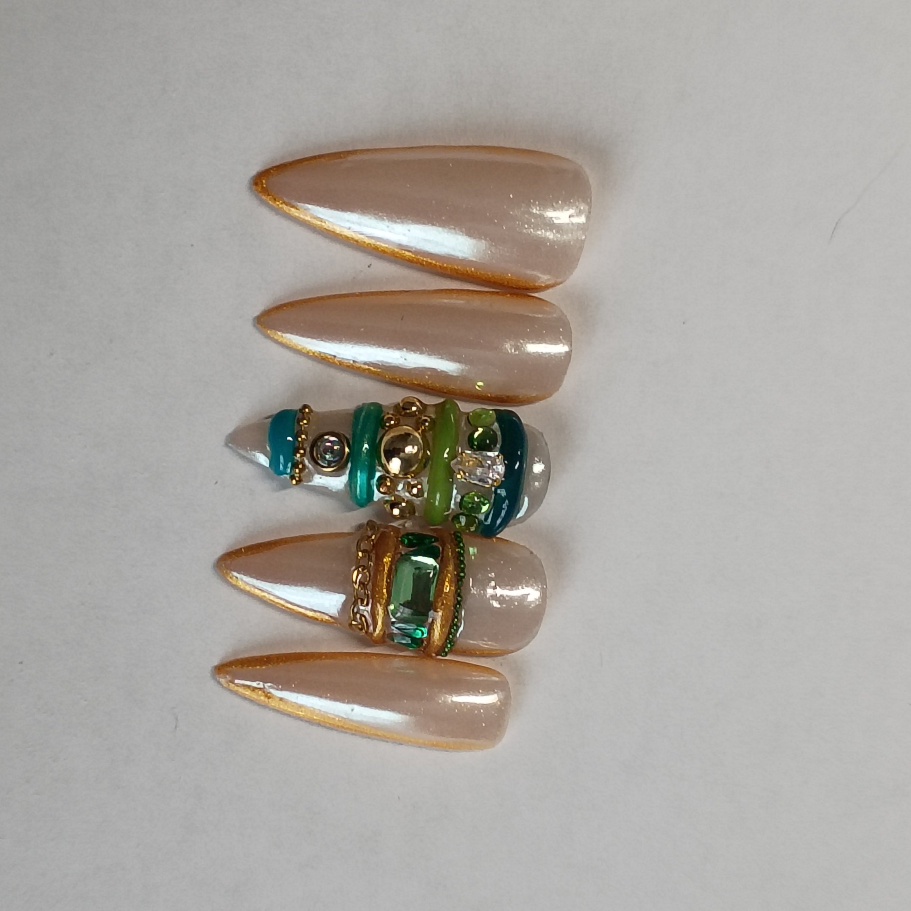 Elegant Chrome Bangle Stiletto Nails with Gold Trim